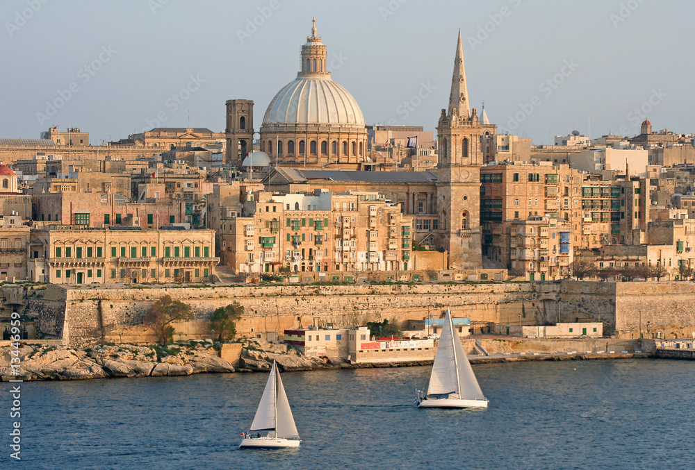 Wall mural yachts sailing by a harbour