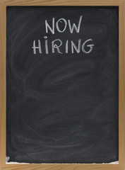 now hiring text on blackboard