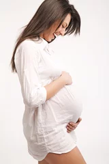 Fototapete Rund Standing pregnant © konradbak