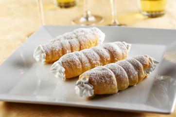 Three rolls filled with sweet cream