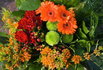Bouquet of flowers in red, orange and green