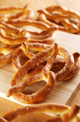 Salty pretzels on wooden desk