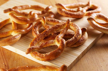 Salty pretzels on wooden desk