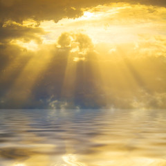 Sunset sun rays through clouds