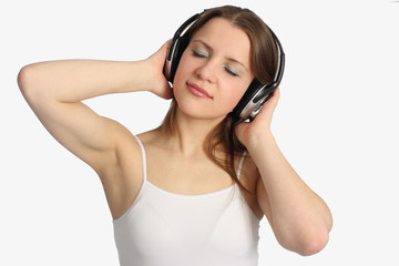 Fototapeta premium Young woman listen music in headphones