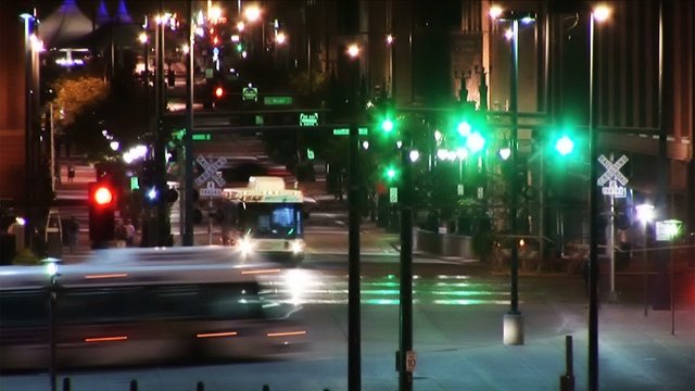 Downtown City Traffic at Night with Buses and Pedestrians (1025)