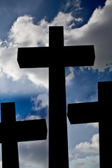 cross silhouette and the clouds at sunset