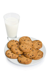 Chocolate chip cookies and a glass of milk isolated on white.