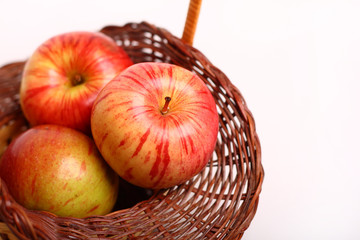Three apples on the besket