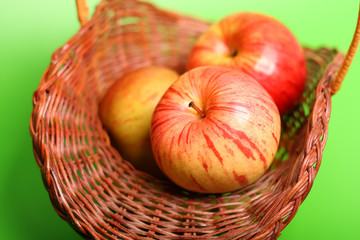 Three apples on the basket
