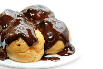 Fresh profiteroles with hot chocolate sauce.
