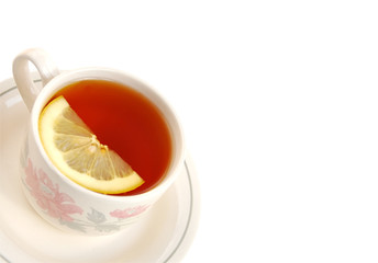 Cup of  tea with lemon slice.