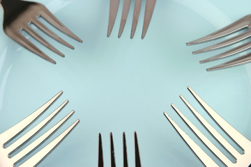 forks on blue dish
