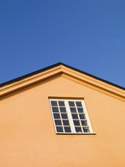 Orange house and blue sky