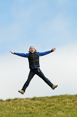 Fototapeta na wymiar child jumping for joy