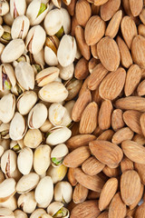 almonds and pistachios background vertical