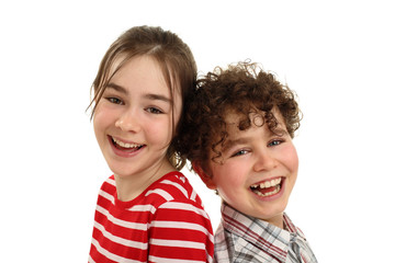 Portrait of two smiling kids isolated on white background