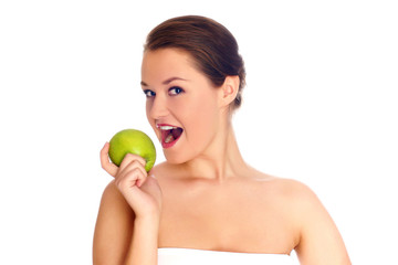 Obraz na płótnie Canvas Young woman eating apple and smile over white background