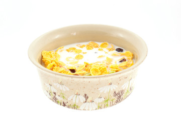 cornflakes with milk in a cup