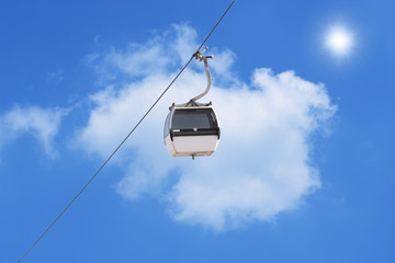 A cable car with a blue background
