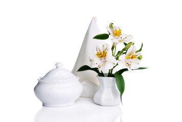 Still life with white objects isolated over white