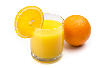 Glass of orange juice with orange