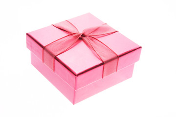 Fototapeta premium Pink giftbox and ribbon (closed) on white background