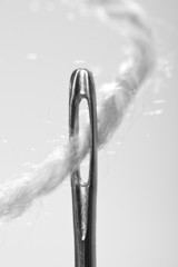 macro thread a needle black and white image
