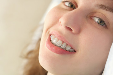 Girl smiles with braces