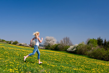 happy young woman on meadow