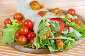 Closeup fresh tortilla on wooden tray