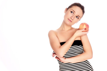 Young woman with apple over white background
