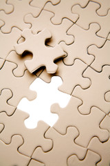 Fototapeta premium Final piece to complete jigsaw puzzle