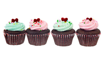 Four cupcakes in a row isolated on white background