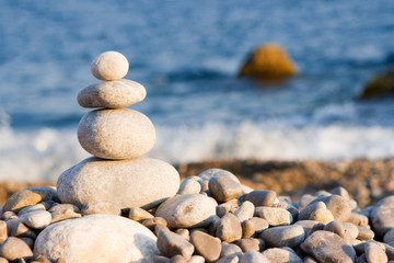 Fototapeta na wymiar balanced stones on the sea