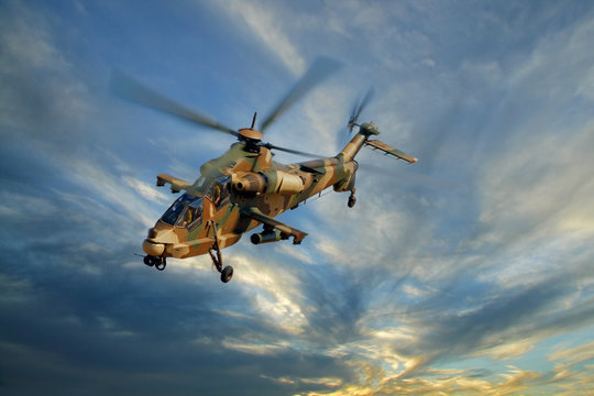 Military helicopter against a dramatic sky