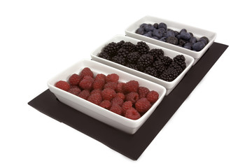 berries in white dishes