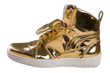 Golden sport shoes isolated on white