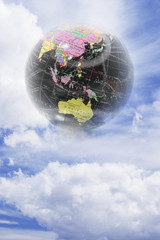 Composite of Globe with Clouds