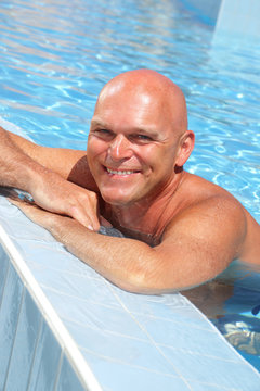 Happy Mature Man In The Swimming Pool