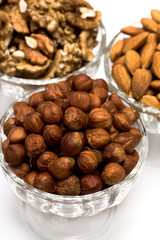 many nuts in glass bowls