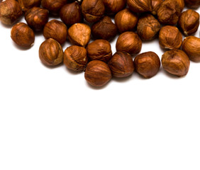 many hazelnuts isolated on white background