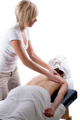 Fototapeta na wymiar Massage therapist giving back massage