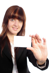 Young pretty business woman showing blank card