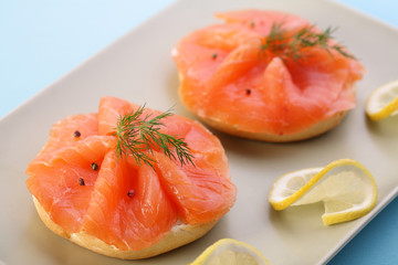 Smoked salmon on bagel with fresh black pepper.