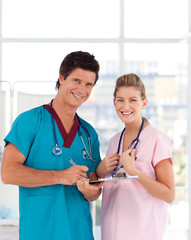 Young Nurse and Doctor smiling at camera