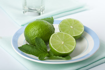 limes and mint on plate