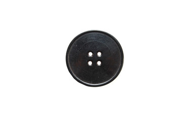Close up of a black button on a white background