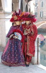Fototapeta na wymiar Couple in Red Carnival Costumes