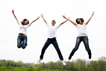 Fototapeta na wymiar Happy friends jumping
